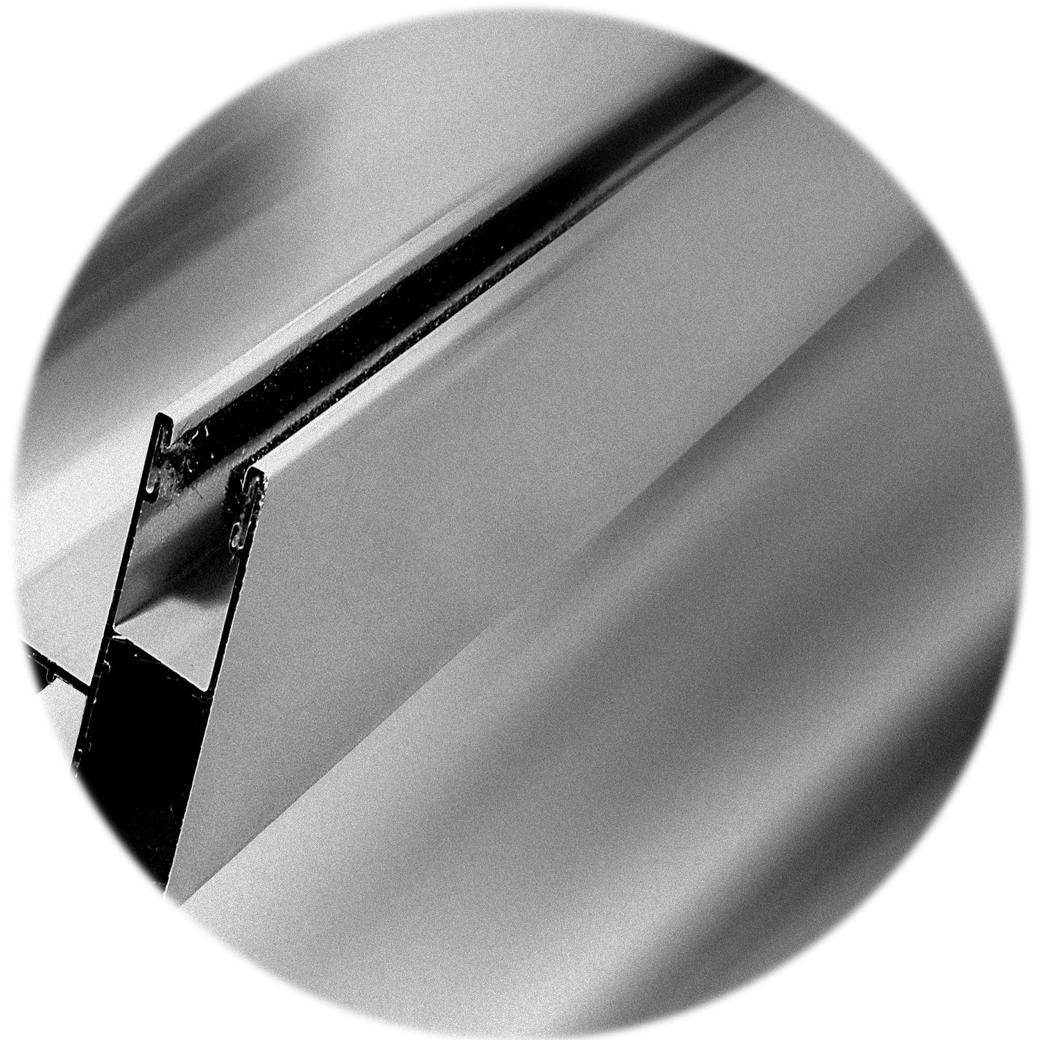 Guia de Aluminio normal o abatible de 4.5 milimetros. Foto decorativa en blanco y negro, con dos felpas